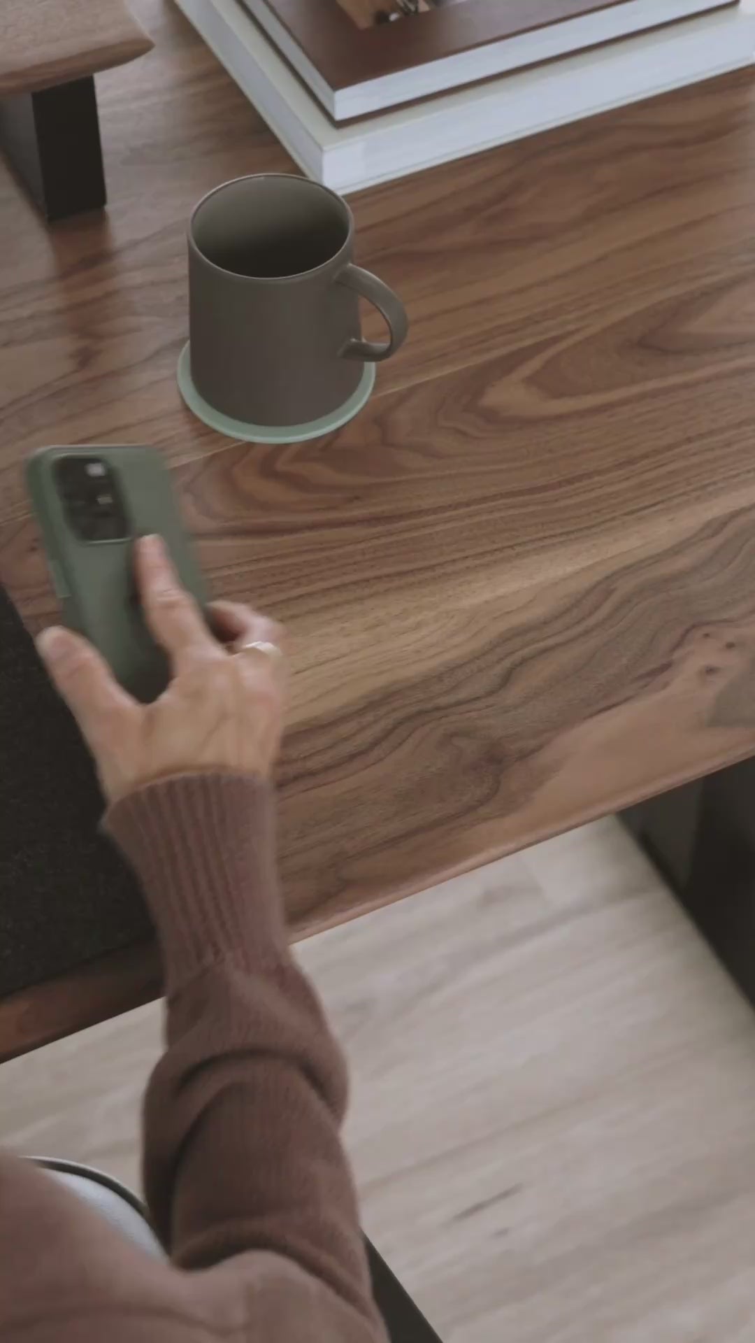 Load video: Close-up of Upwood&#39;s premium American walnut desktop, showcasing natural wood grain patterns and eco-friendly oil finish while in use, demonstrating superior craftsmanship and material quality. height-adjustable-standing-desk-sit-stand-desk